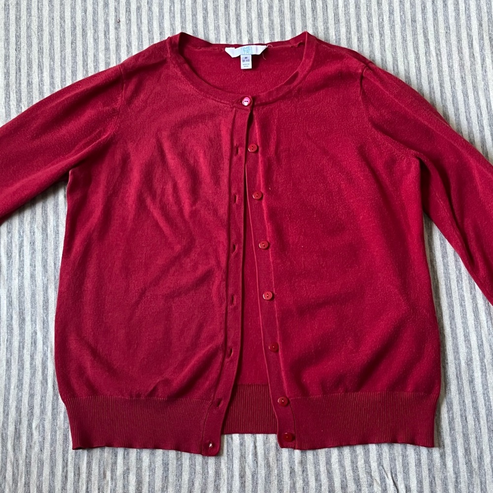 Red cardigan with red buttons